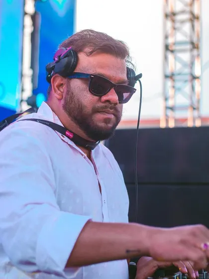 A close-up of me at the decks during a sunny Holi festival.