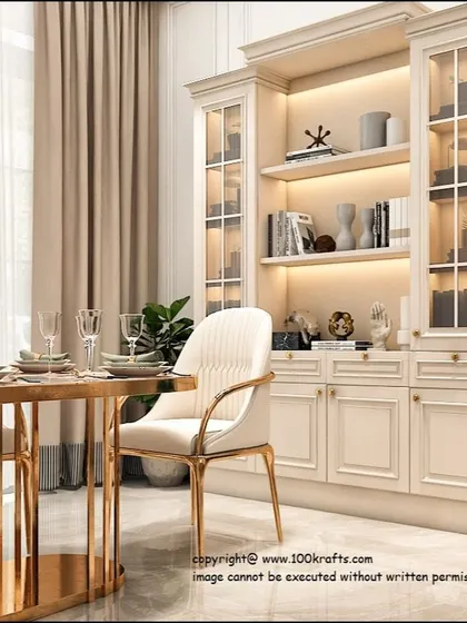 A luxurious dining area with a gold-finished table, cream chairs, and a classic display cabinet with integrated lighting.