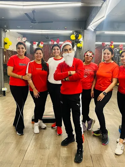 Even I got into the Christmas spirit. Posing with my amazing crew during our festive workout, which was filled with laughter and holiday cheer.