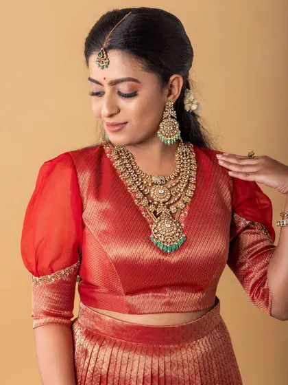 Another look from the same campaign, this time with a red outfit. I used neutral tones on the eyes to complement the heavy, layered necklace.