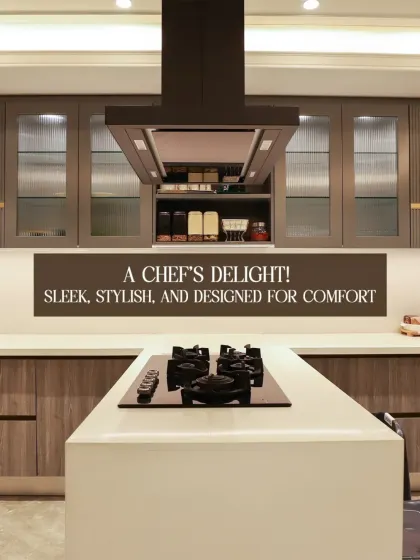 A chef's delight. This kitchen is sleek, stylish, and designed for comfort, featuring a large island cooktop, modern chimney, and ample storage with fluted glass cabinets.