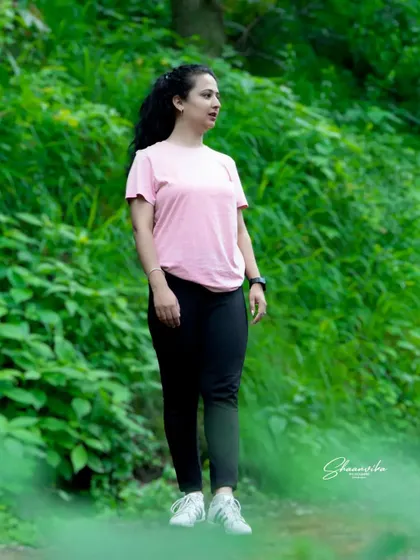A candid shot of the bride-to-be during a walk in the woods. These unposed, natural moments are often the most beautiful.
