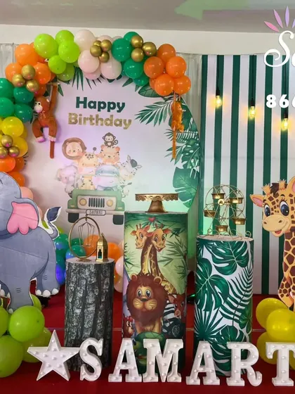 Let's go on an adventure. This jungle-themed birthday party setup is complete with animal cutouts, balloon garlands in earthy tones, and themed props to create a wild and fun celebration for the little explorer in your life.