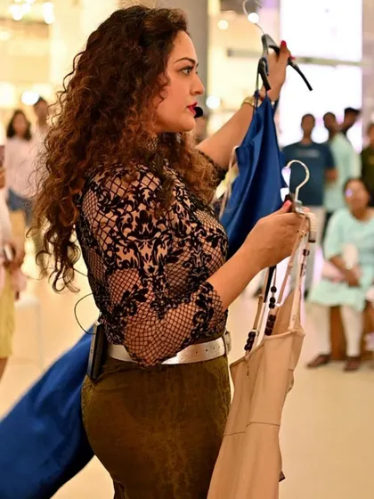 A hands-on styling workshop is where theory meets practice. Here, at the Bhartiya Mall of Bengaluru, I'm demonstrating how to select pieces that flatter different body shapes and personal styles. My goal is to empower women with the confidence and skills to dress with flair every day.