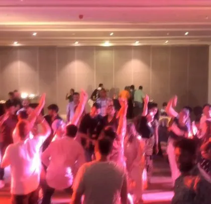 The dance floor was a sea of hands at the Rohm corporate party. The energy was incredible, and the crowd didn't want to go home.