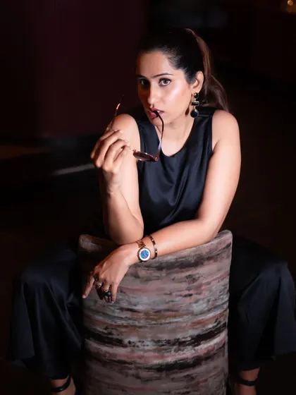 A playful and engaging portrait from the same series. I encourage clients to interact with props, like these sunglasses, to make the photos more dynamic.