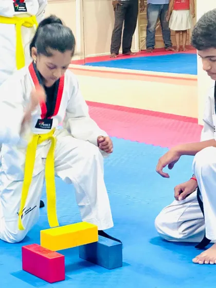 A focus and precision drill where a student practices breaking small blocks.