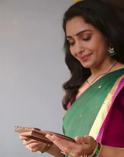 A still from a recent SBI TV commercial. This look required natural, relatable makeup that feels warm and authentic for a family setting.