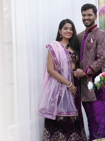 Another lovely shot of the couple in their matching traditional wear. The outfits are perfect for an indoor, elegant pre-wedding photoshoot.