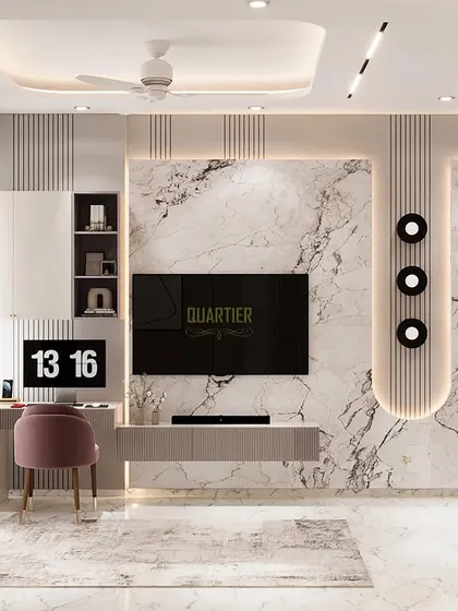 The TV unit and workstation in the Gaur Saundaryam master bedroom render. The design is clean and contemporary, with a marble-look backdrop and ample storage, making it both beautiful and practical.
