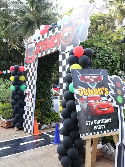 The entrance to the 'Cars' themed birthday, complete with a starting line arch and a welcome sign for Jehaan's 5th birthday.