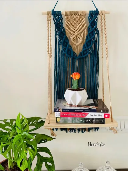 This wall shelf was a custom order. The client wanted a beautiful way to display her books and a small cactus. The deep teal and off-white combination looks so elegant.