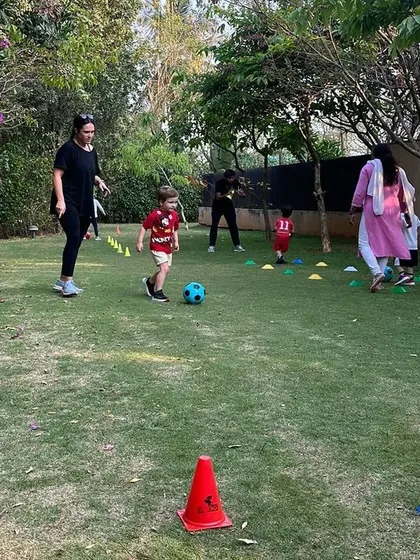 Parents join in the fun, creating a wonderful community atmosphere during our football classes.