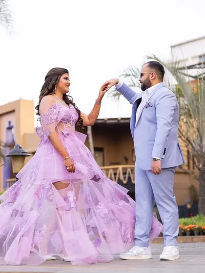 A romantic dance pose. Her flowing gown and soft makeup create a beautiful picture.