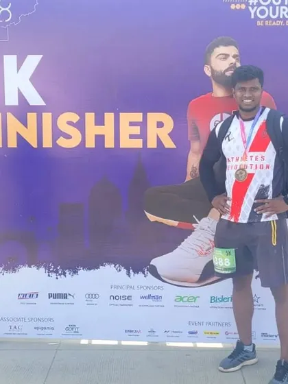 Me at the 5k finisher board for the One8 Run. It's always a great feeling to cross the finish line.