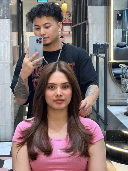 A selfie with my client showing off her new butterfly haircut. The layers frame her face beautifully and add so much life to her hair.