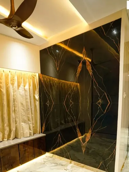Book-matched tiles create a stunning, symmetrical pattern that can turn a simple wall into a work of art. Here, I used them to create a dramatic and luxurious feature wall in the living area.