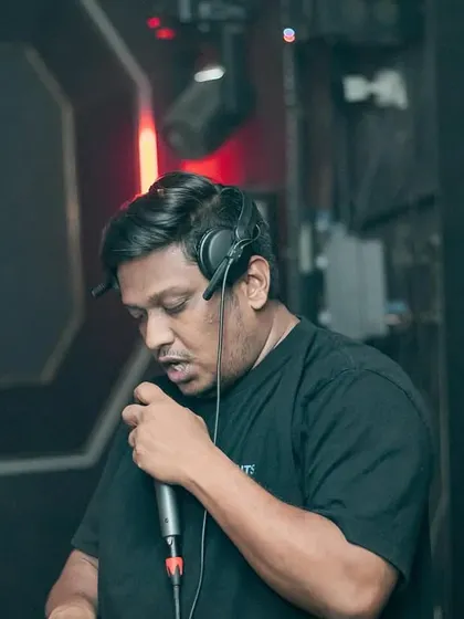 On the mic, talking to the crowd. I believe a DJ should be more than a music player; I'm a host, an MC, and the life of the party.