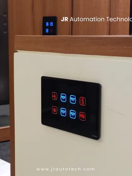 Our touch panels are designed to complement any architectural style. Here, a black glass panel is installed against both a white wall and a rich wood-paneled surface, showing its versatility and how it adds a modern touch to the space.