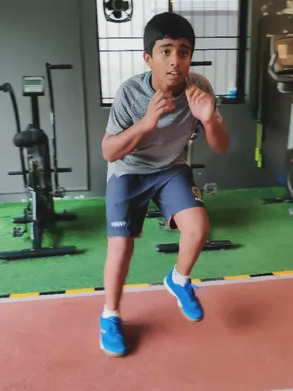 A young athlete develops his coordination and quickness with agility drills, building a strong foundation for his sport.