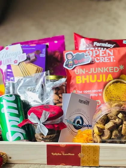 This Rakhi snack tray includes an evil eye card for protection, adding another layer of thoughtfulness to the gift.