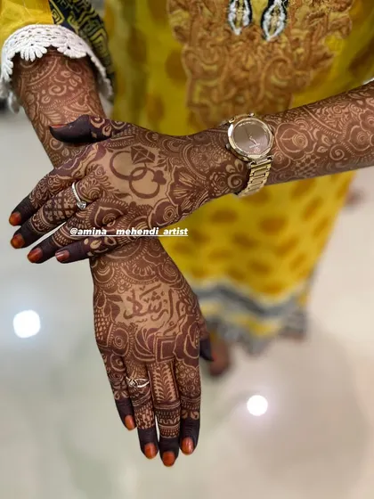 This beautiful henna design was created for an engagement, featuring the couple's initials and a name written in Urdu. The stain here is just one day old and already so rich.