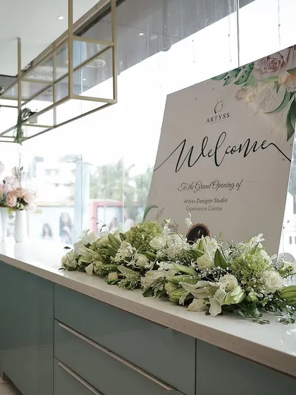 A shot from inside our Experience Centre on launch day. The welcome sign and beautiful floral arrangements created an elegant and inviting atmosphere.
