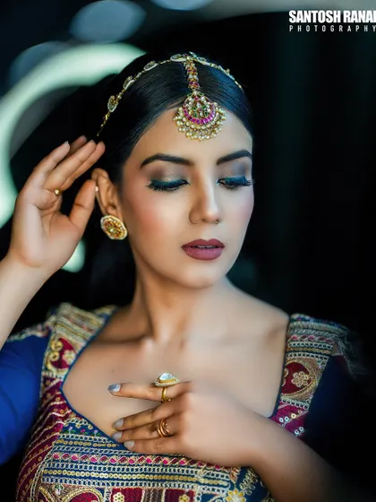 This portrait focuses on the makeup and traditional head jewelry (maang tikka). It showcases how we collaborate with makeup artists to complete the look.