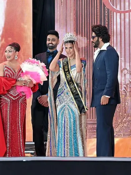 The crowning moment at a beauty pageant. This is a priceless shot for any contestant, capturing the peak of their achievement and emotion.