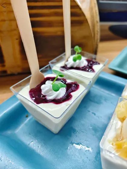 When dessert looks like art and tastes even better. These beautiful panna cotta cups are topped with a vibrant berry compote and fresh microgreens.