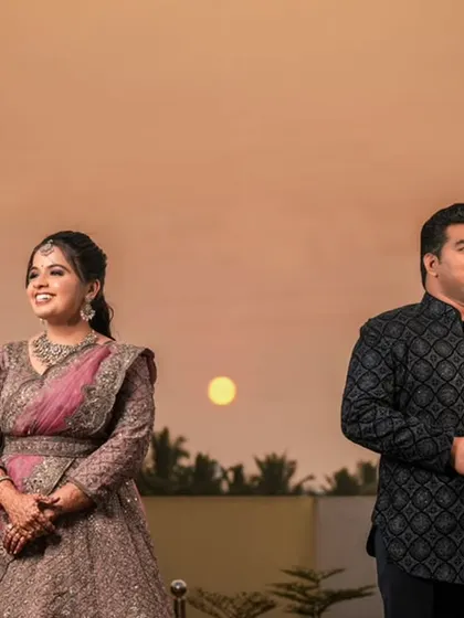 A candid shot of the couple enjoying the sunset view.