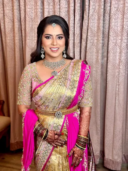 A final portrait of the reception look, showing the glowing skin, defined eyes, and beautiful smile.