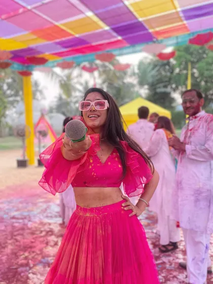 Mic in hand, ready to kickstart a vibrant Haldi Holi celebration in Goa. The colorful decor and the energy of the guests make destination weddings like these incredibly special to host.