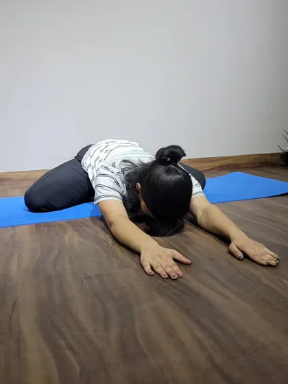 The child's pose is a restorative posture I use in almost every session. It's a simple but powerful way to gently stretch the back, hips, and thighs, and to calm the mind after a tough workout.