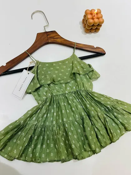 This green floral print dress is a perfect example of our comfortable and stylish everyday wear. It's a versatile piece that can be dressed up or down for any summer occasion.
