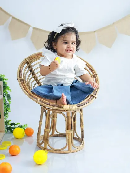 A happy smile from this little girl in her wicker chair. These simple studio sessions are perfect for capturing timeless portraits at any age.
