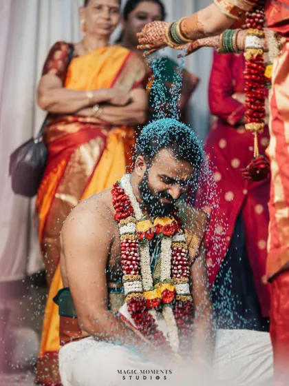 The Akshata ritual, where the groom is showered with blessed rice. I capture this moment in a way that shows the motion and emotion.