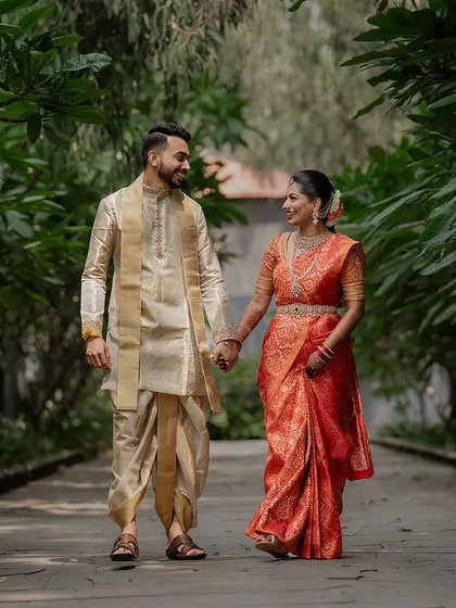 A quiet, intimate portrait framed by lush greenery. We use natural elements to create a sense of romance and tranquility in our couple's wedding photos.