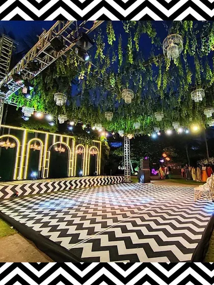 For a modern and chic sangeet, we designed this stunning black and white chevron dance floor. Paired with a lush green ceiling and elegant chandeliers, it created the perfect stage for a night of non-stop dancing.