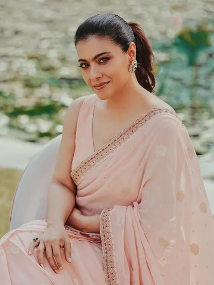 A vision in pastel pink. I styled this soft, feminine saree with simple earrings and a pulled-back ponytail for a fresh and elegant look, perfect for a daytime event in Kolkata.