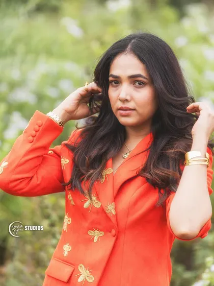 This vibrant orange suit with custom bee embroidery is a perfect example of our playful yet chic Indo-Western designs.