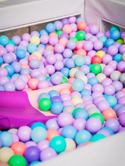 A colorful ball pit filled with pastel-colored balls provided another fun and safe play area for the little guests at the Mystic Wonderland party.