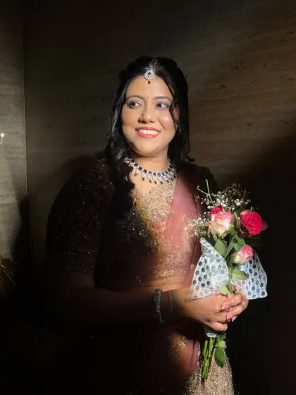 A happy, smiling bride in the shadows.