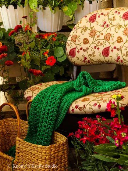 The colours of nature in the monsoons are so brilliant. This deep green throw, casually placed on a floral chair, reflects the sparkling greens of a rainy day.