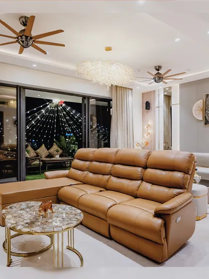 From this angle, you can see how the living area opens up to a beautifully lit balcony. This connection between indoor and outdoor spaces makes the entire home feel larger and more inviting.