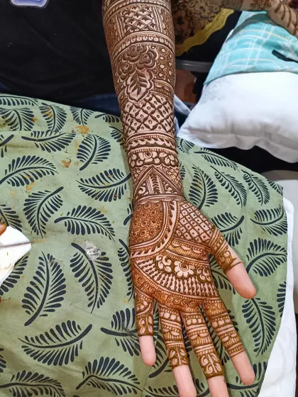 This is a great example of a dense, traditional Indian mehendi design. The pattern is filled with paisleys, dots, and fine lines, leaving very little negative space for a truly rich look.