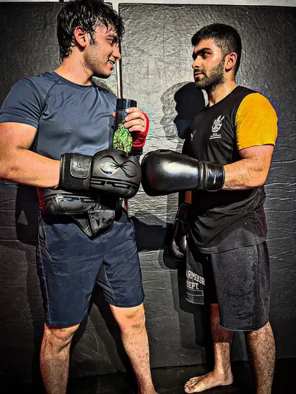 The calm before the storm. Two of our fighters, Yash and Rohan, facing off before a sparring session. Iron sharpens iron.