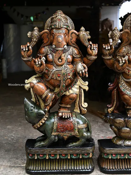 A close-up of the 41-inch Ganesha dancing on his mooshak vahana, highlighting the interaction between the two figures.