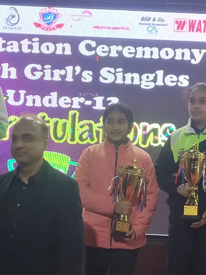 Akanksha Singhal on the podium after winning a silver medal in the U-13 Girls Team event at the Delhi State Championship. Her consistent podium finishes are remarkable.