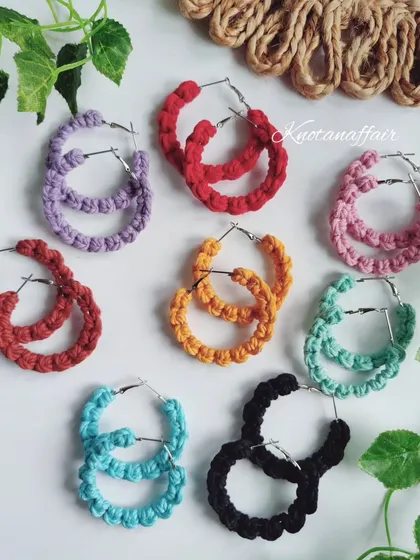 A rainbow of macrame hoop earrings! This picture showcases the variety of colors available for customization. They are perfect for bulk orders.